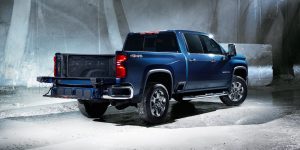 Blue 2022 Silverado 2500 HD pick up truck surrounded by concrete walls.