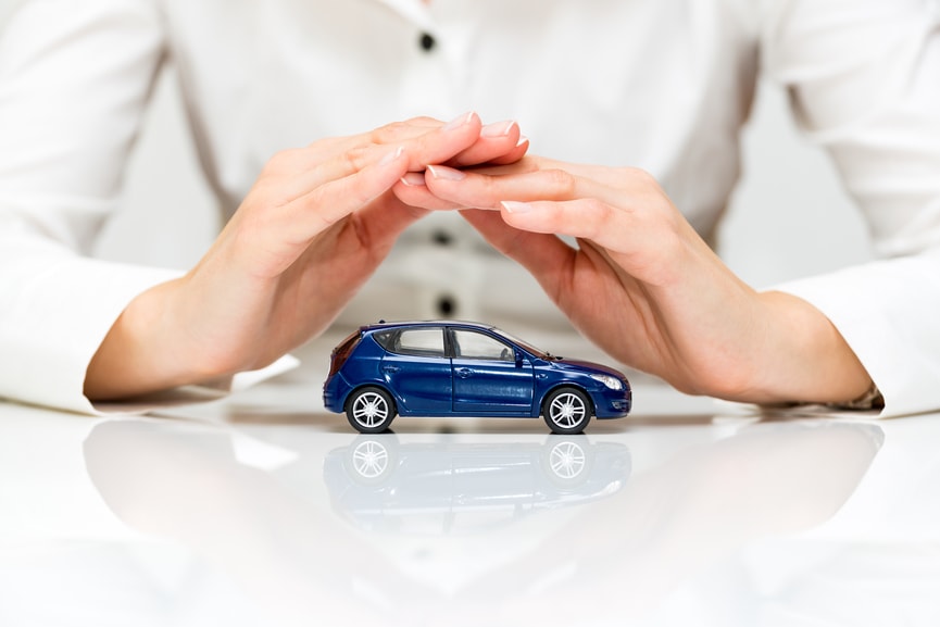 Person covering a car with their hands