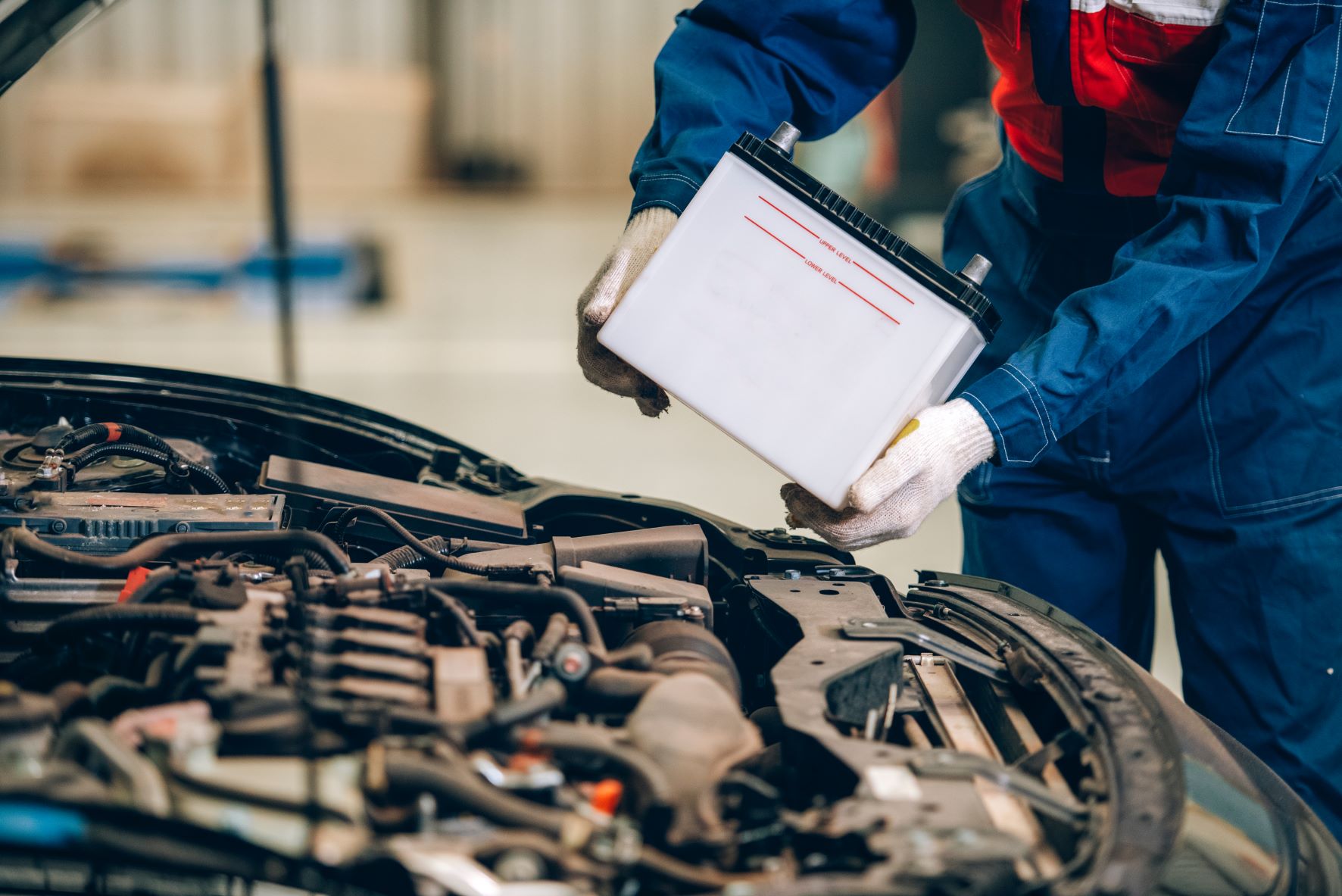 Chevy service technician installing a battery